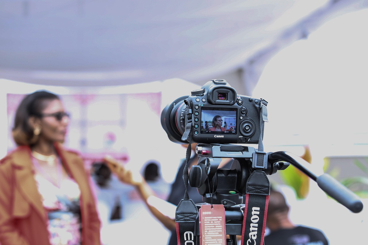 Professional videographer operating a cinema camera during a legacy interview session